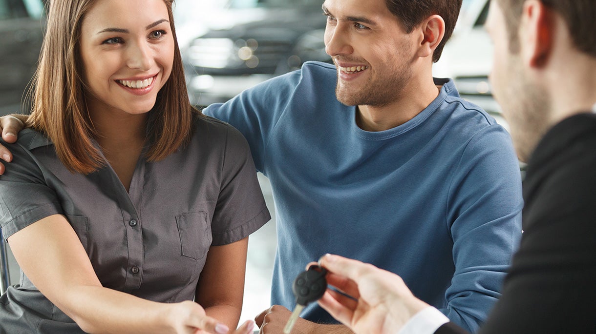 Happy couple receiving new keys