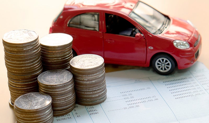 car model, Paper with coins on table