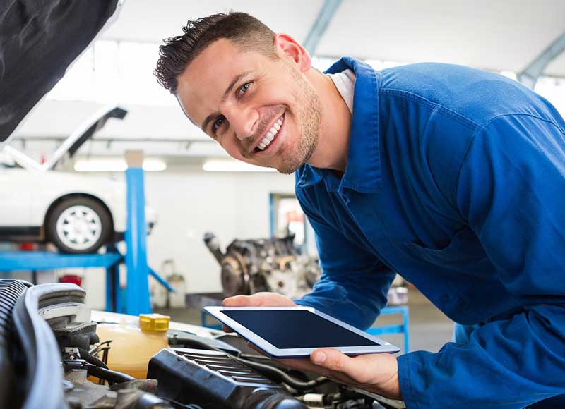 Smiling technician performing a check